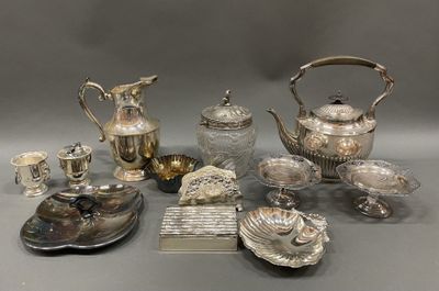 many different silver items on a table together