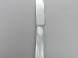 a knife that is sitting on top of a plate
