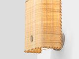 a close up of a light fixture on a wall