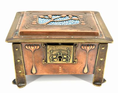 a small wooden box with a decorative design on it