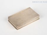 silver plated business card case on a white surface with a white background