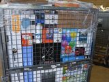 a metal cart with many items in it in a warehouse