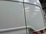 a white van with a red stripe on the side of it