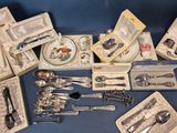 many different types of silverware on a table