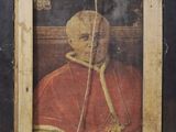 an old picture of a man in a red robe with a rope around his neck