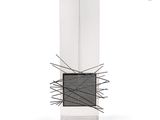 an image of a modern glass and metal sculpture