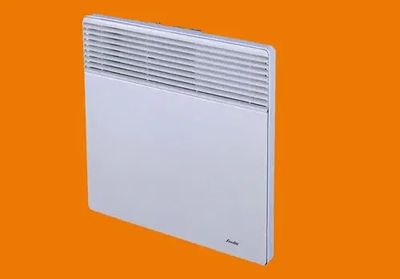 a white electric heater sitting on top of an orange background