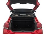 the back of a red car with its trunk open on a white background
