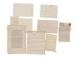several old letters and envelopes are stacked on top of each other
