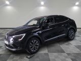 the black suv is parked in a large room with a checkered floor