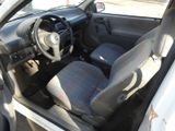 the interior of a car with the door open and the steering wheel down
