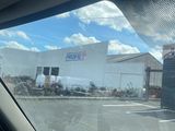 a view of a building from inside a car window