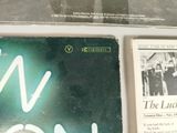 two books that are on display on a table