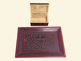 a wooden box and a red rug on the floor