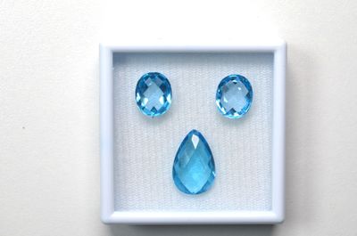 a picture of a picture of a face made out of blue gems