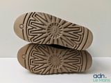 the soles of a pair of shoes are shown on a white surface