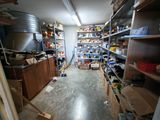 a room filled with lots of shelves and shelves filled with items
