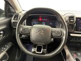 the interior of a car with a steering wheel and dashboard controls