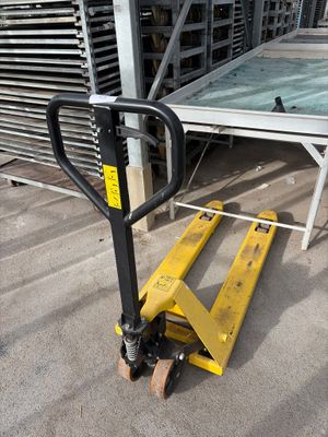 a pallet that is sitting on the ground next to a building