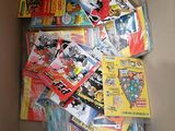 a cardboard box full of comic books in it