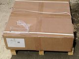 a cardboard box sitting on a pallet in a warehouse