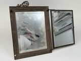 a picture of a person taking a picture of themselves in a mirror