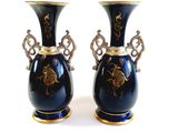 two vases that are sitting on a white surface