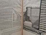 an open book with a drawing of a building in the middle of it