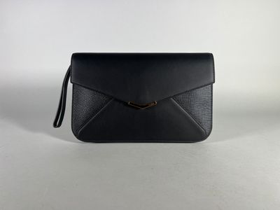 a black leather clutch bag with a gold clasp