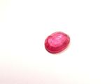 pink tourmaline gems on a white surface with a white background