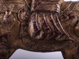 a statue of a man riding a horse with a man on it