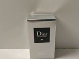 a picture of a dior homme cologne bottle on a table