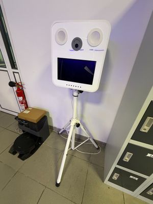 a television that is sitting on a tripod in a room