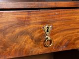 a close up of a drawer with a key on it