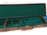 a suitcase that has a green cloth inside of it