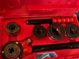 an image of a red tool box with a wren set in it