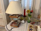 a lamp that is on a table in a room