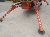an image of a construction vehicle with a crane attached to it ' s back