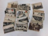 a pile of old postcards sitting on a table