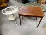 a small table and a small chair in a room