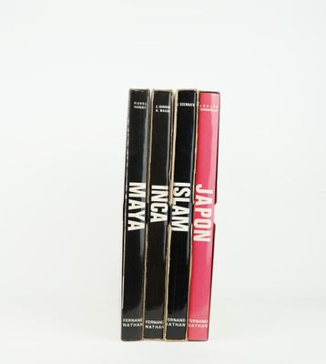 three books are stacked on top of each other on a white surface