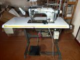 a sewing machine sitting on a table in a room