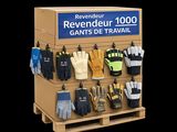 many pairs of gloves hanging on a rack in a store