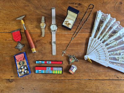 a lot of items that are on a wooden table