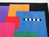 a colorful rug with squares and squares on it