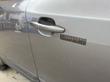 the door of a car with a sticker on the side of it