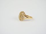 a gold ring with a cluster of diamonds on it