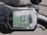 a close up of a bicycle with a gps device on it ' s handlebar