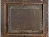 an old wooden picture frame with a picture hanging on the wall