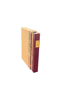 a book that is sitting on a white surface